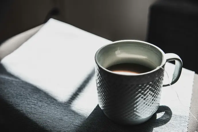 selective focus photography of mug
